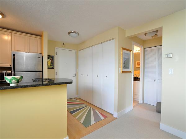 a view of a kitchen with refrigerator and microwave