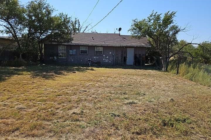 1129 South Huff Road Pampa, TX 79065 - Photo 2 of 2 a front view of a house with a yard