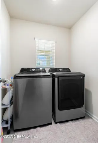 a view of a workspace with furniture