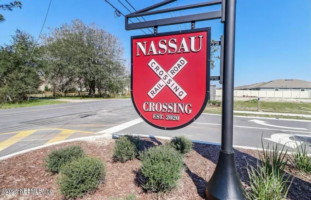 a view of a brick house with a bench and a bench