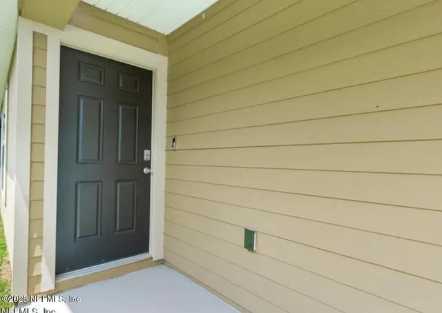 a kitchen with stainless steel appliances a refrigerator and cabinets