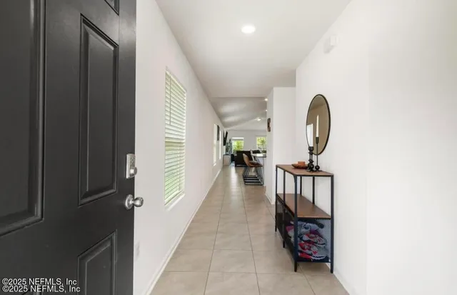 a kitchen with stainless steel appliances granite countertop a stove top oven a refrigerator a sink and a granite counter tops