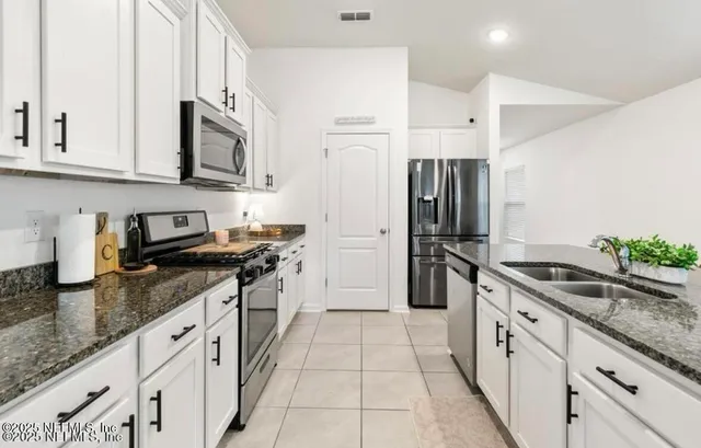 a store room with lots of furniture and clutter