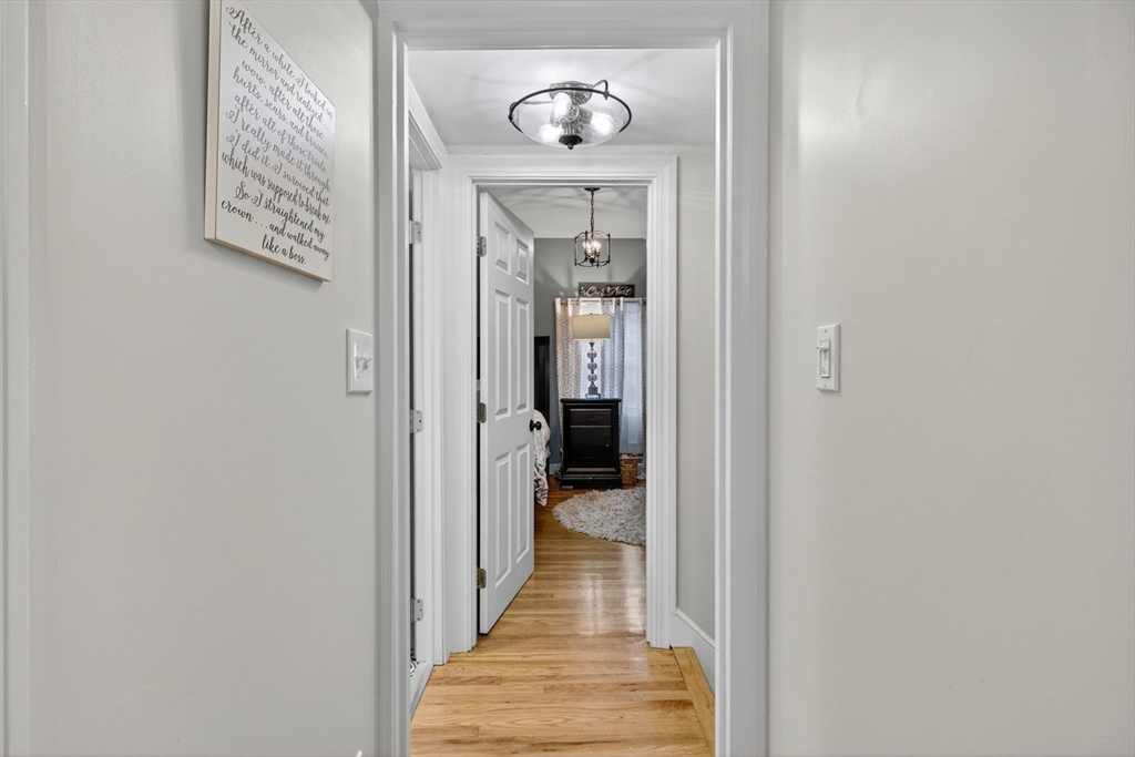 14 Ferndale Road Natick, MA 01760 - Photo 21 of 33 a view of a hallway with wooden floor and a hallway