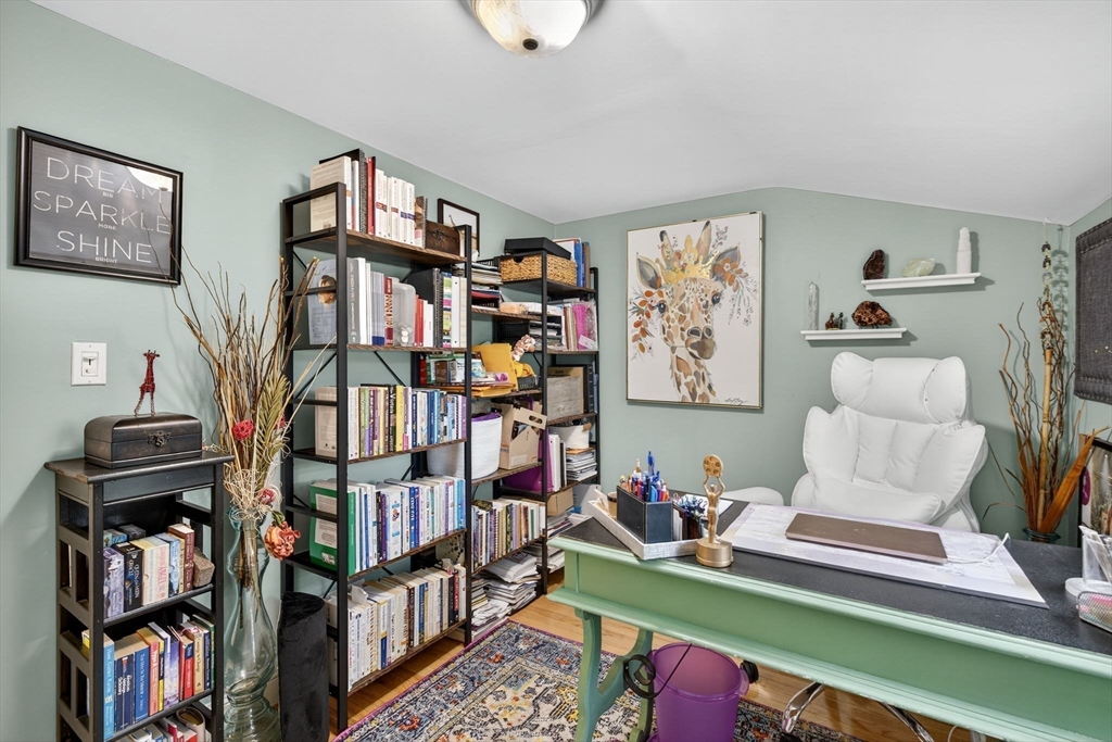 14 Ferndale Road Natick, MA 01760 - Photo 29 of 33 a living room with lots of furniture and a book shelf