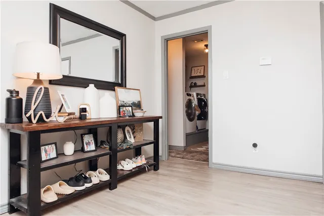 a view of living room and wooden floor