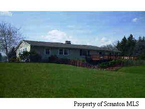 16 Schelbert Road Newfoundland, PA 18445 - Photo 3 of 8 a view of a house with a backyard