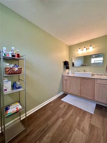 a bathroom with a double vanity sink and a mirror