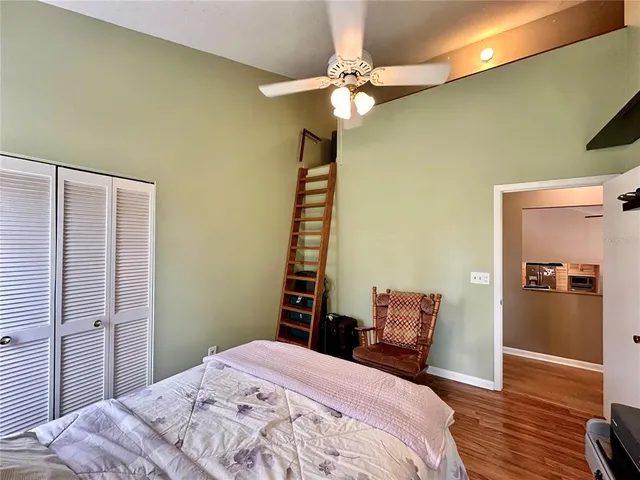 a very nice looking room with many windows and furniture