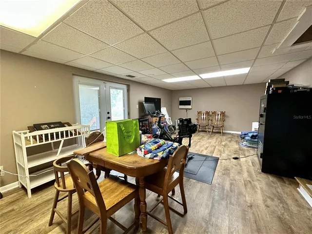 a outdoor space with patio the couches and a dining table with the view of the ocean