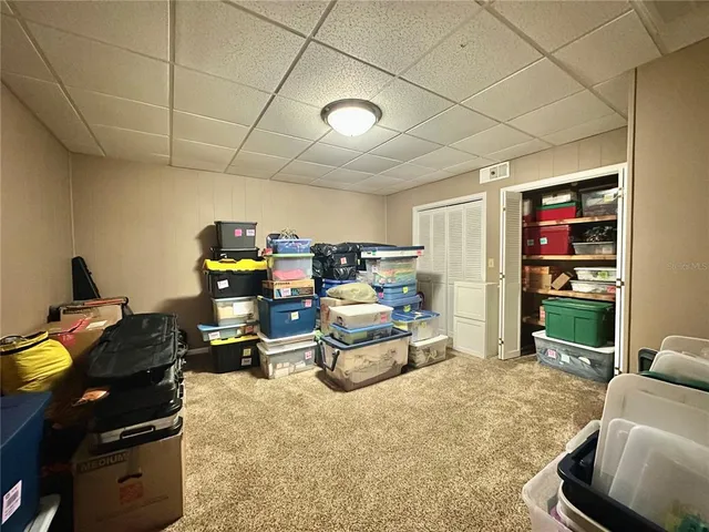 a backyard of a house with lots of green space and fountain