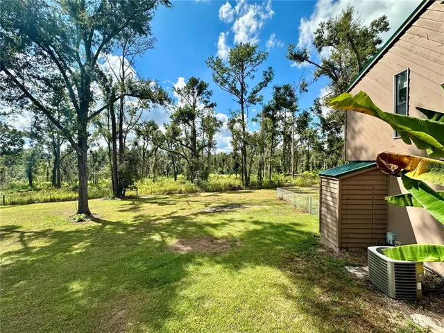 a view of a swimming pool with an outdoor space and seating area
