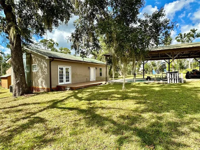 a backyard of a house with lots of green space