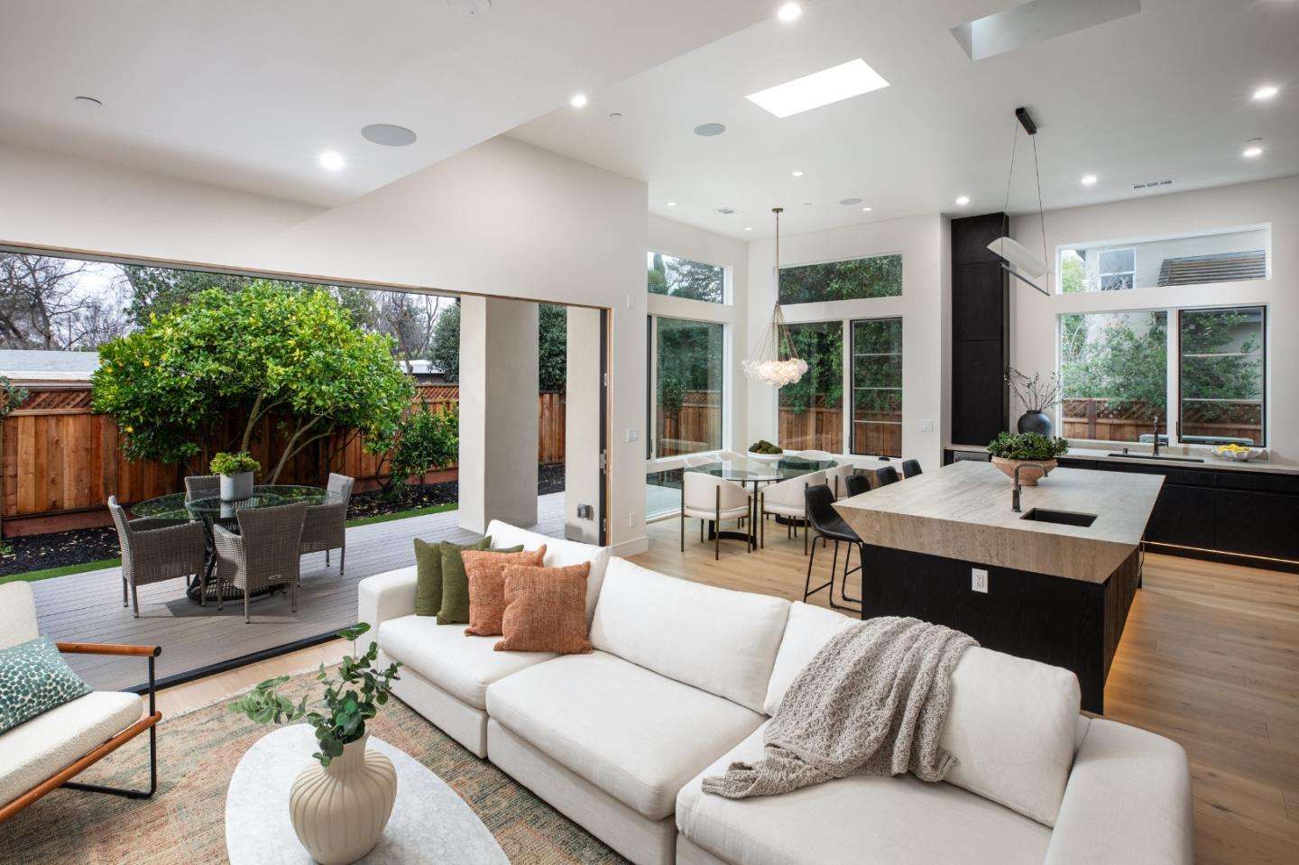 3413 Ross Road Palo Alto, CA 94303 - Photo 13 of 45 a living room with furniture potted plant and a large window