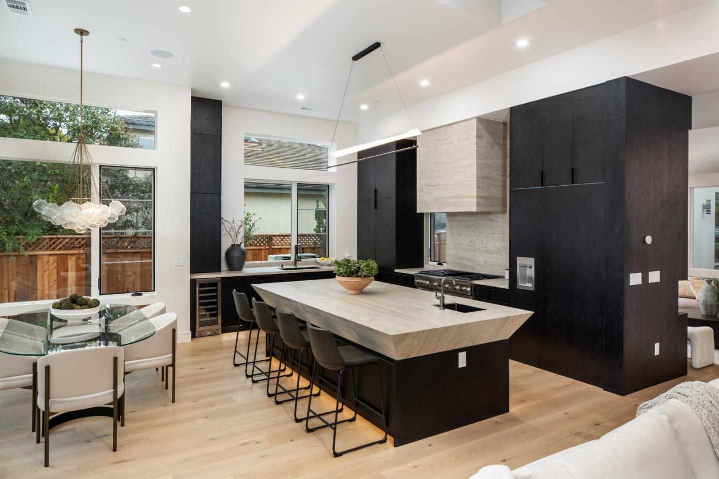 3413 Ross Road Palo Alto, CA 94303 - Photo 16 of 45 a kitchen with a table chairs and a refrigerator