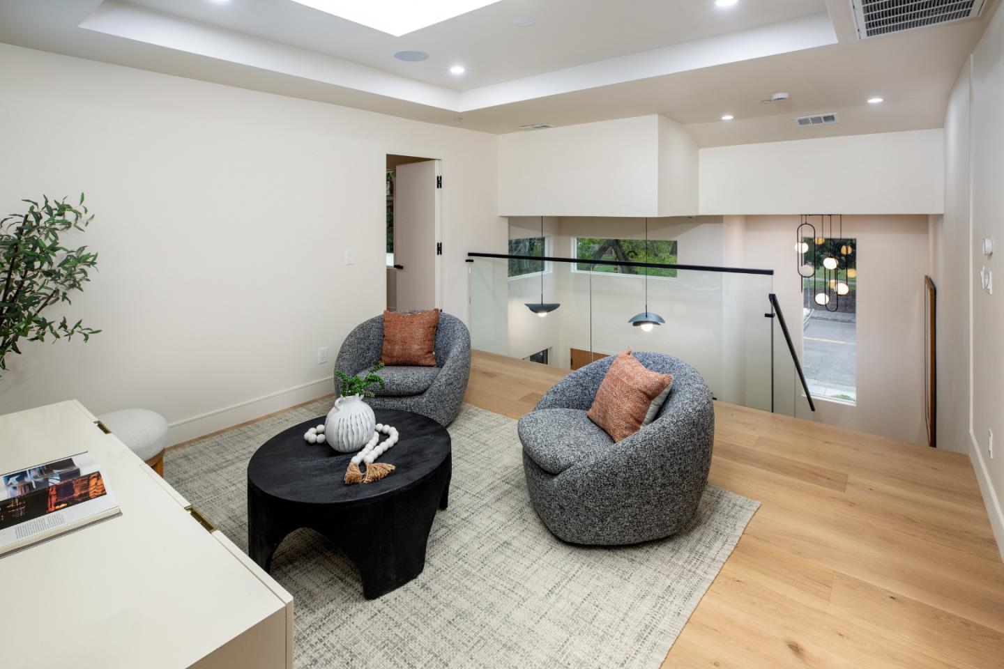 3413 Ross Road Palo Alto, CA 94303 - Photo 23 of 45 a living room with furniture and a potted plant
