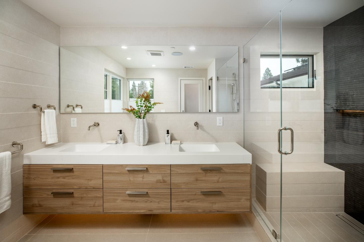 3413 Ross Road Palo Alto, CA 94303 - Photo 27 of 45 a bathroom with a double vanity sink mirror and shower