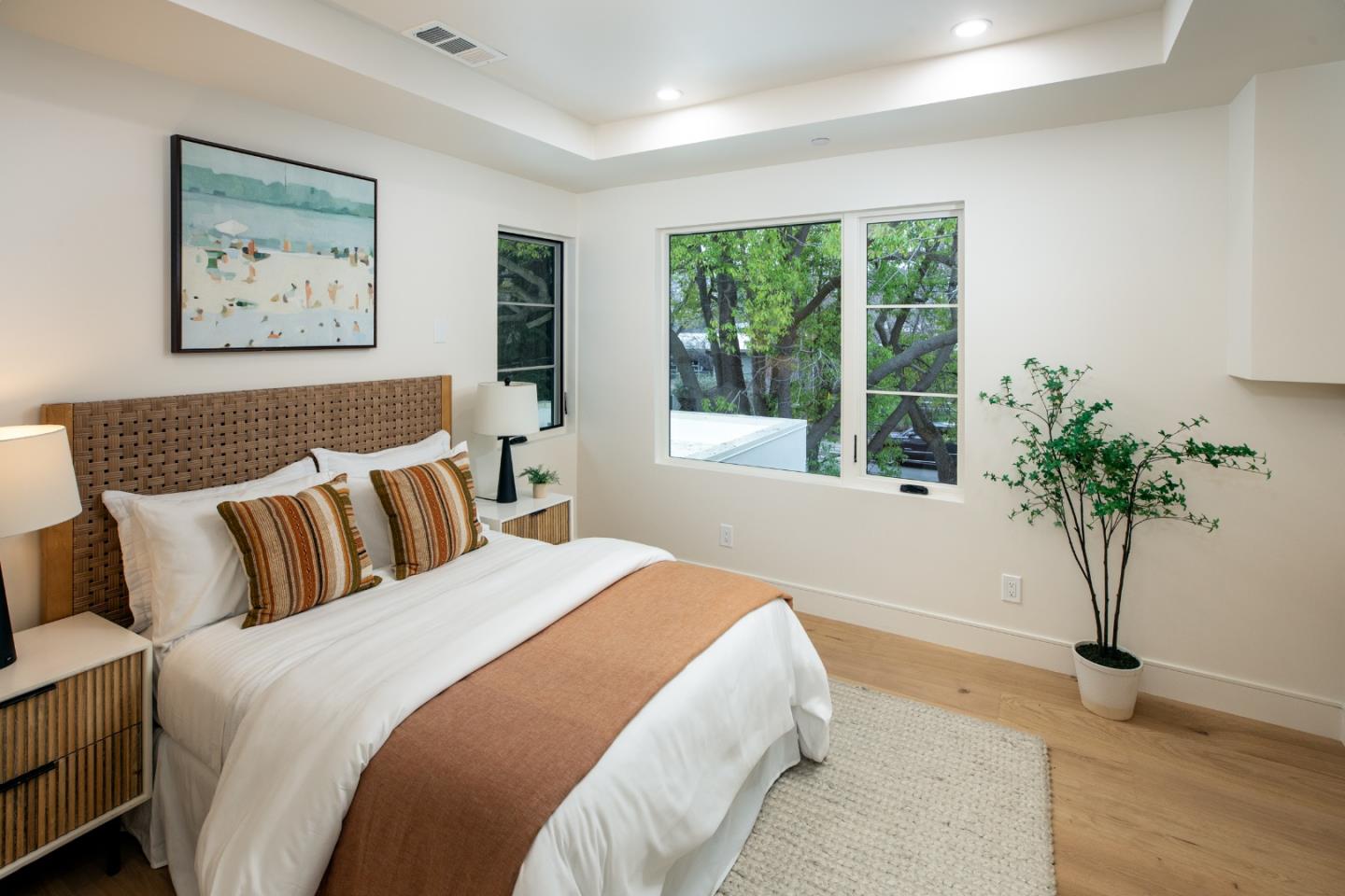 3413 Ross Road Palo Alto, CA 94303 - Photo 33 of 45 a bedroom with a large bed and a potted plant