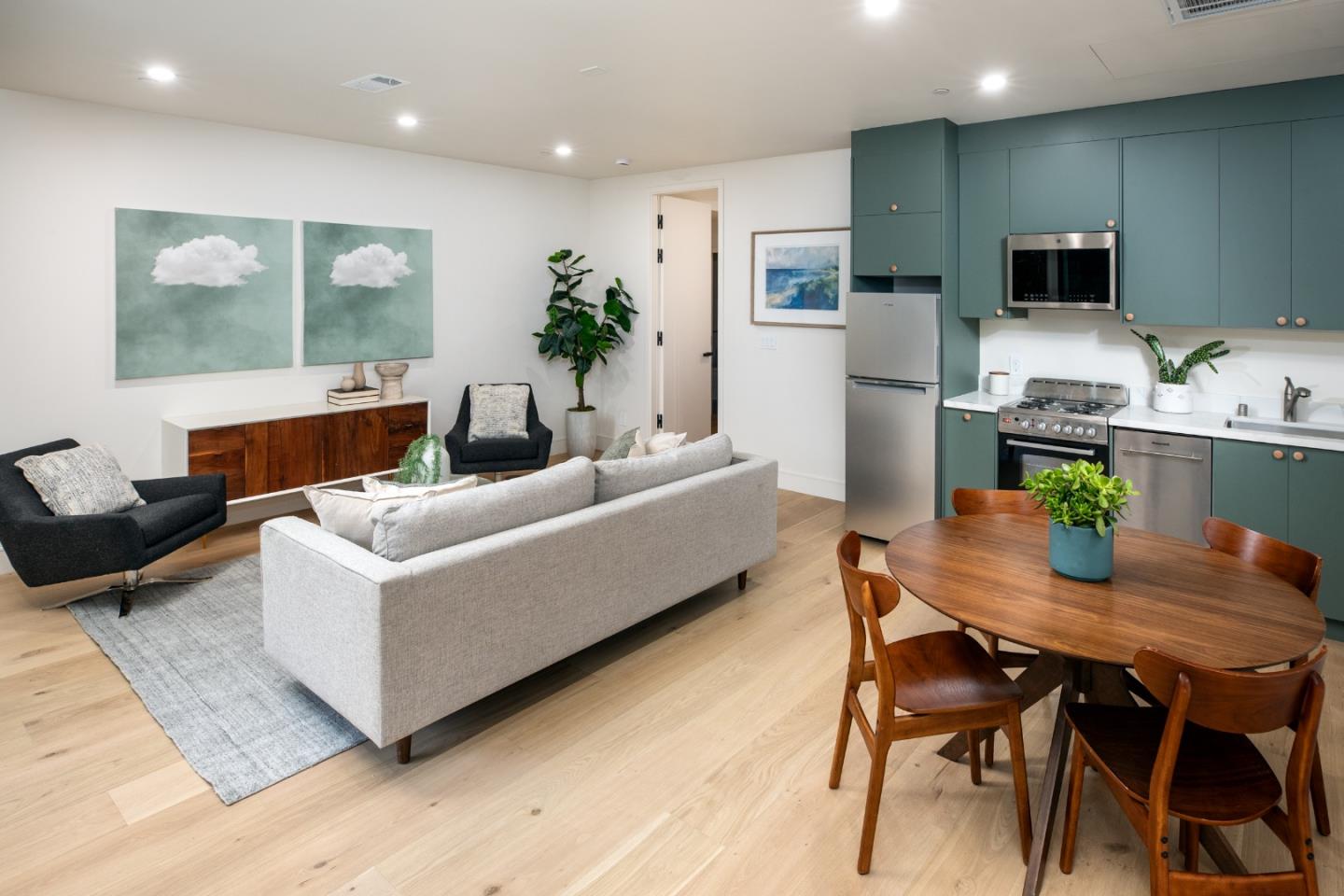 3413 Ross Road Palo Alto, CA 94303 - Photo 38 of 45 a living room with furniture kitchen view and a wooden floor