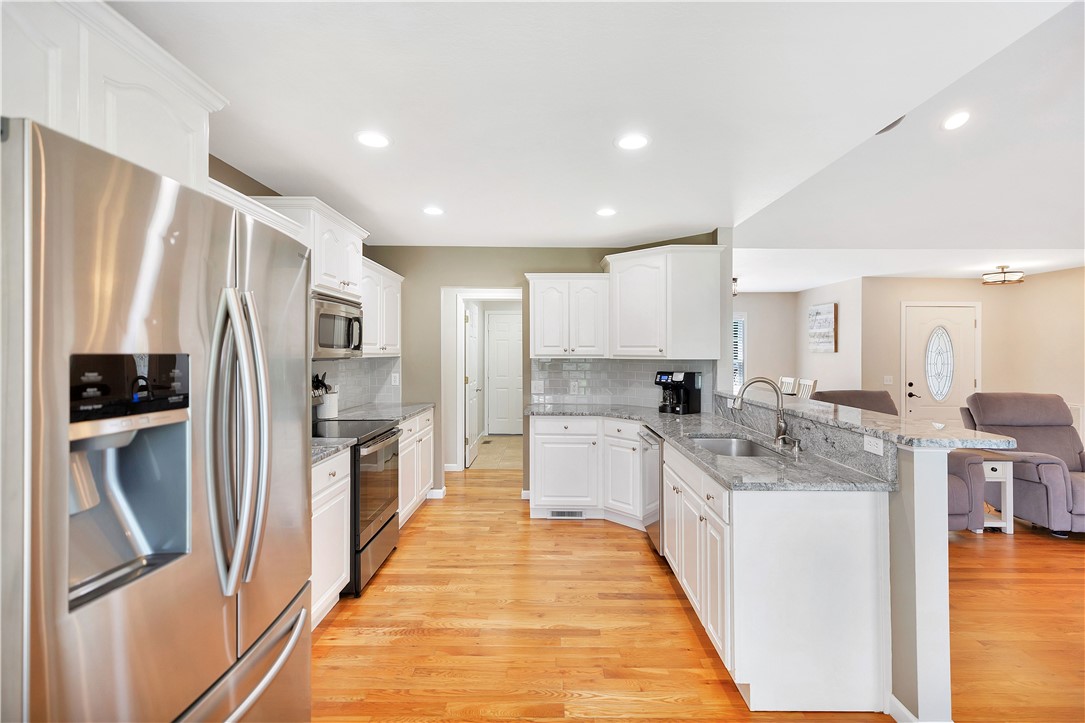 131 Morgan Road West Union, SC 29696 - Photo 7 of 39 A streamlined kitchen layout with gleaming hardwood floors and ample counter space.