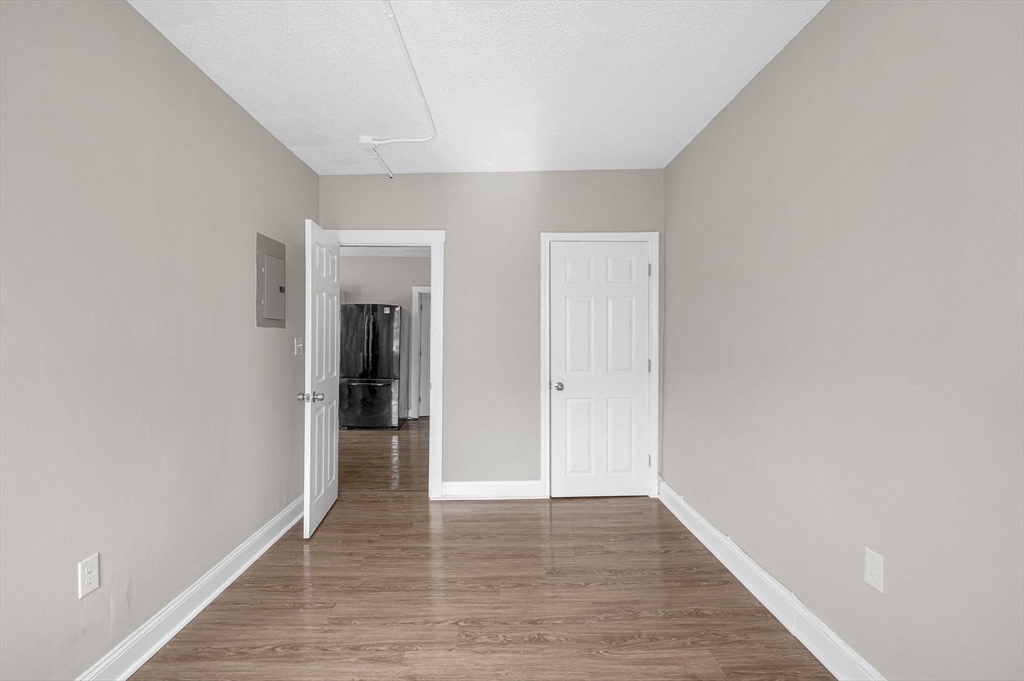 50 1/2 Common Street, Unit 5 Lawrence, MA 01840 - Photo 12 of 18 a view of a hallway with wooden floor