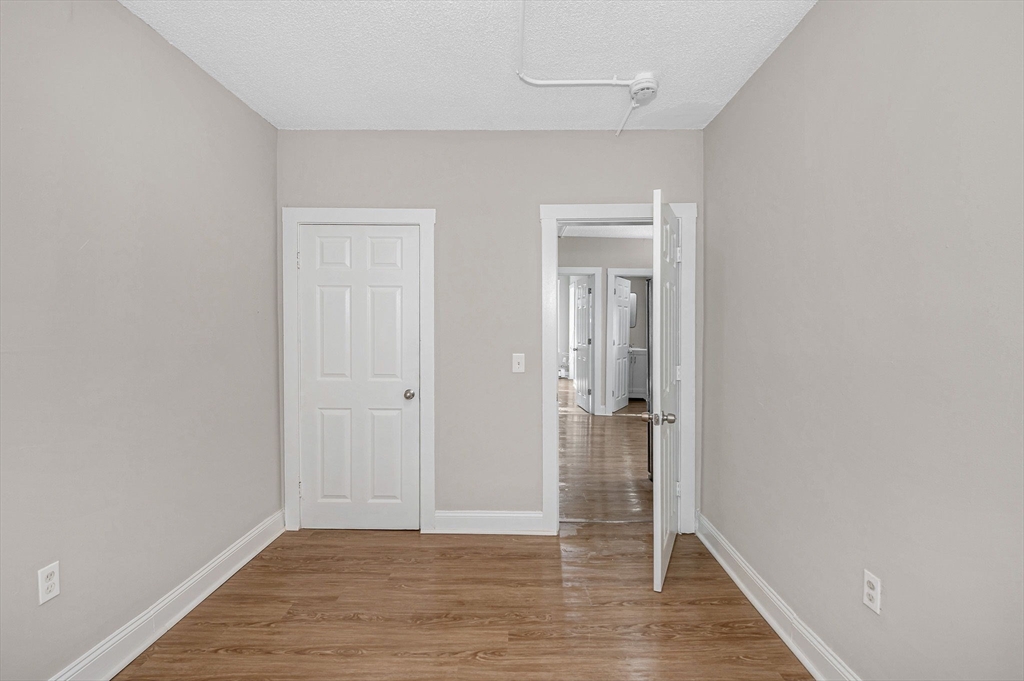 50 1/2 Common Street, Unit 5 Lawrence, MA 01840 - Photo 18 of 18 wooden floor in an empty room