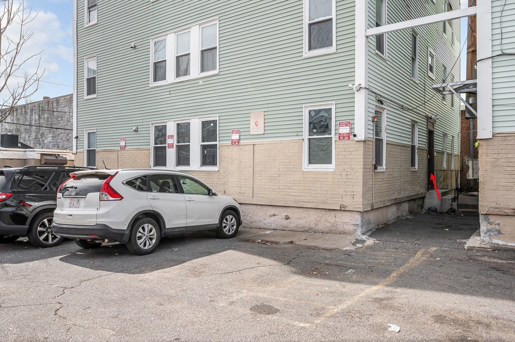 50 1/2 Common Street, Unit 5 Lawrence, MA 01840 - Photo 2 of 18 a car parked in front of a house