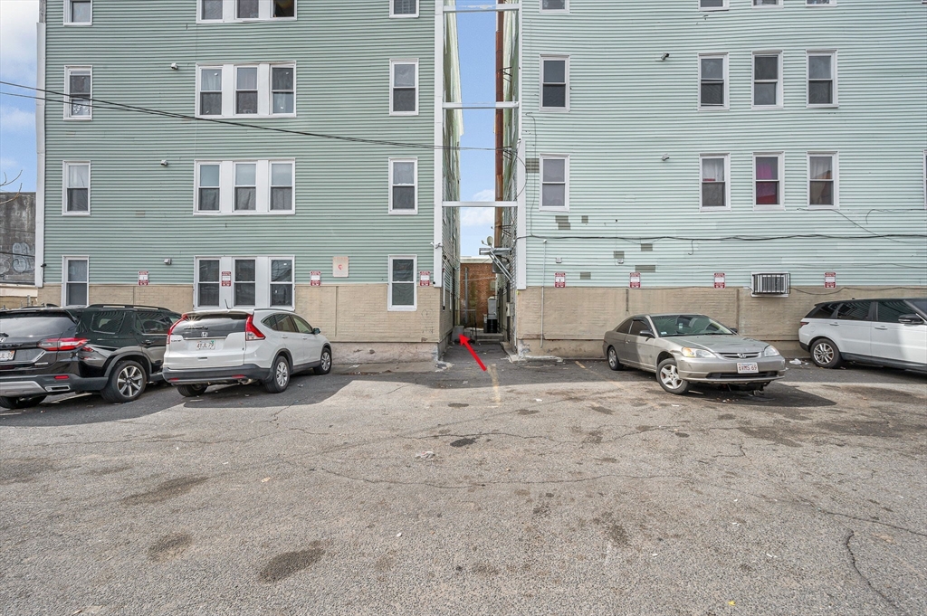 50 1/2 Common Street, Unit 5 Lawrence, MA 01840 - Photo 3 of 18 a car parked in front of a building