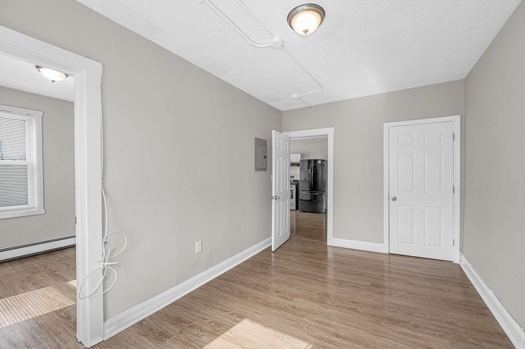 50 1/2 Common Street, Unit 5 Lawrence, MA 01840 - Photo 9 of 18 a view of a hallway with wooden floor