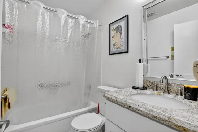 a bedroom with a bed and a flat screen tv in it