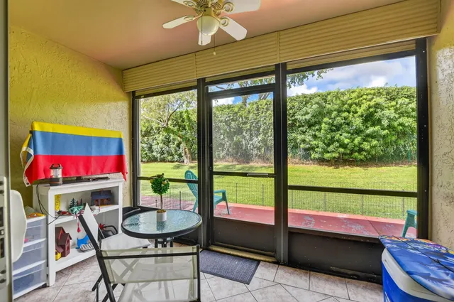 a view of a livingroom with furniture window and wooden floor