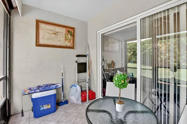 a view of a a dining room with furniture window and wooden floor