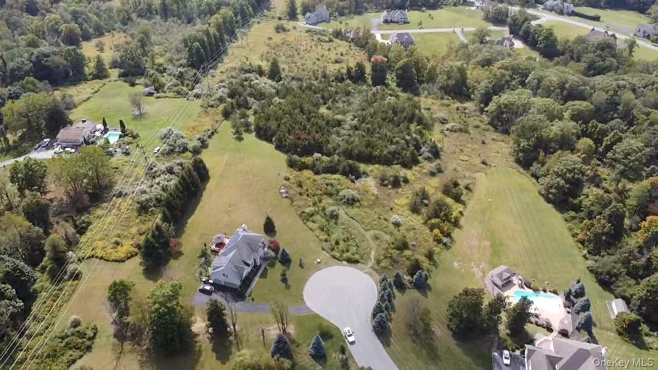 8 Camelback Road Chester, NY 10918 - Photo 4 of 11 a aerial view of a house with a yard and lake view