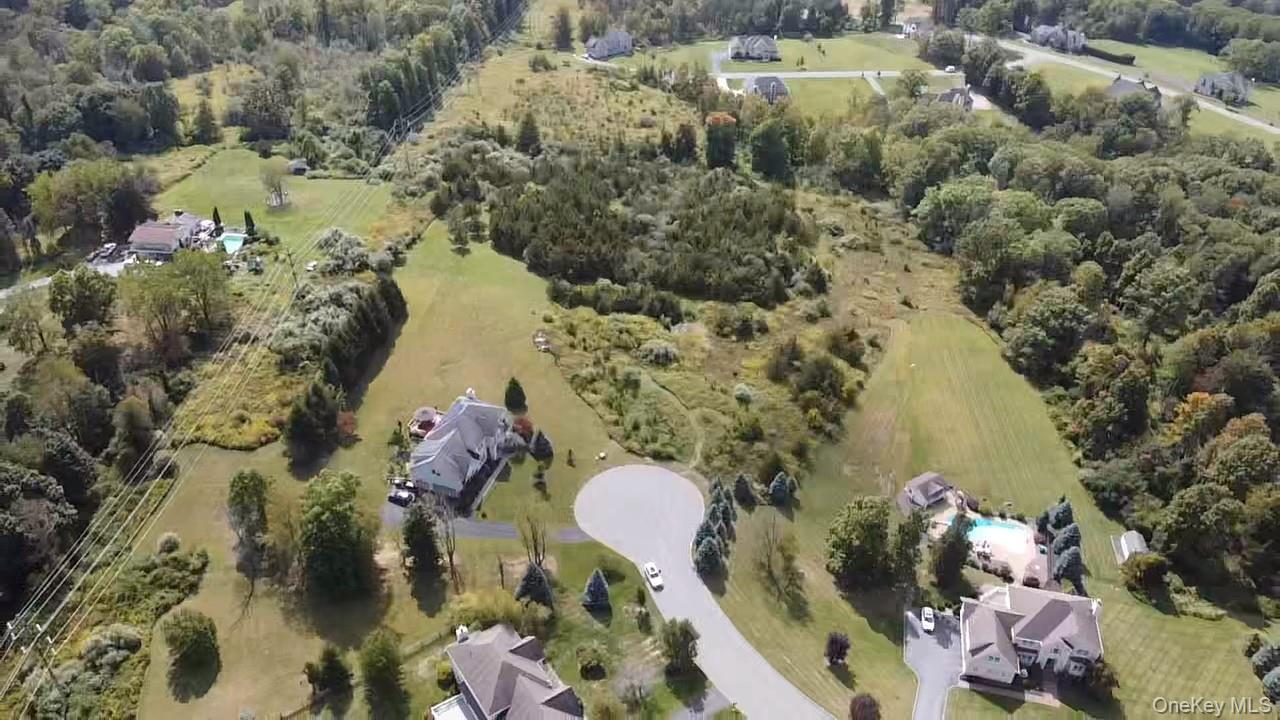 8 Camelback Road Chester, NY 10918 - Photo 6 of 11 an aerial view of a house with a yard and large trees