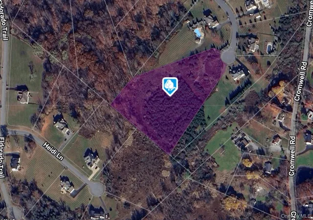 a aerial view of a house with a yard