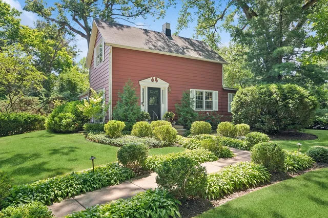 a view of a house with a yard and plants