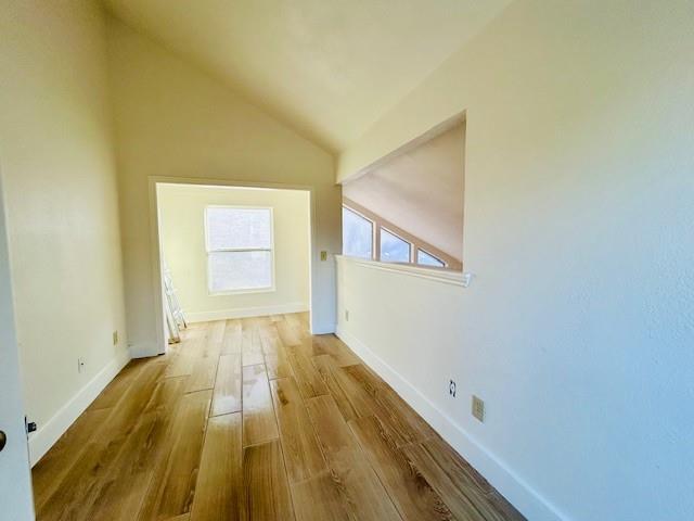 17119 Upper Bay Road Addison, TX 75001 - Photo 22 of 29 a view of a room with wooden floor and brick walls