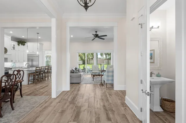 a kitchen with stainless steel appliances granite countertop a sink a stove and a refrigerator