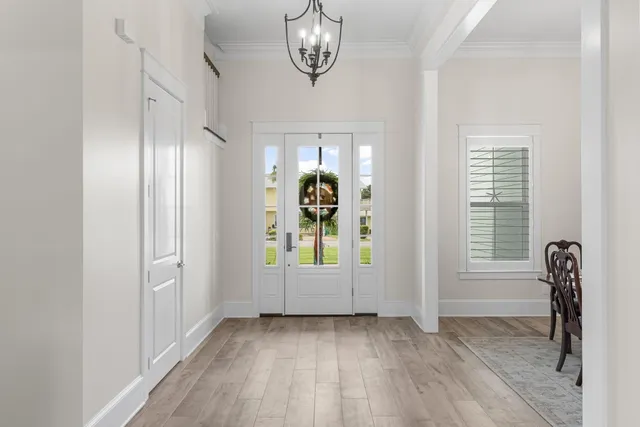 a kitchen with granite countertop a sink stove and cabinets