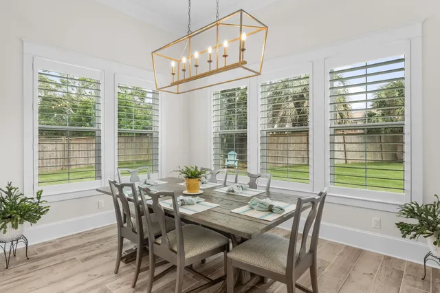 a bathroom with a granite countertop sink a mirror and shower