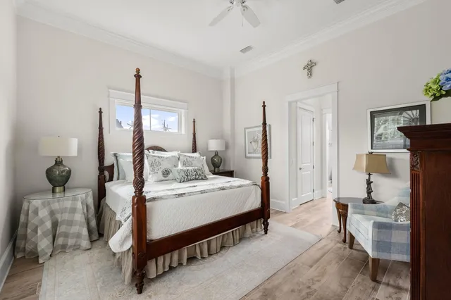 a bed room with a bed and a ceiling fan