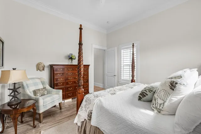 a bedroom with a bed and a dresser