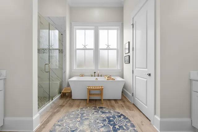a bathroom with a granite countertop sink a toilet and shower
