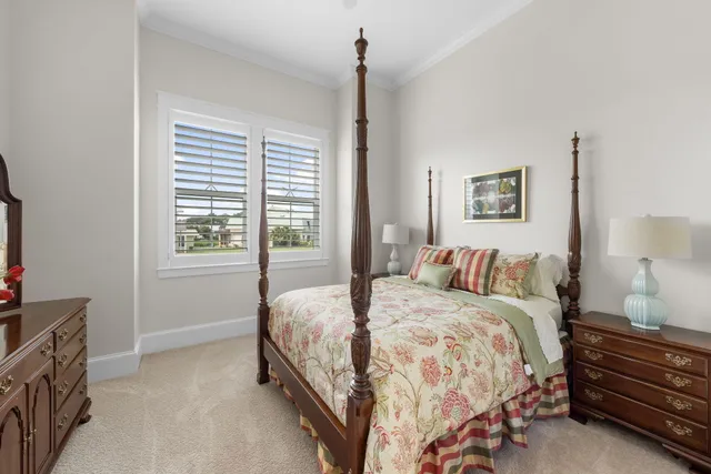 a living room with patio furniture and a garden