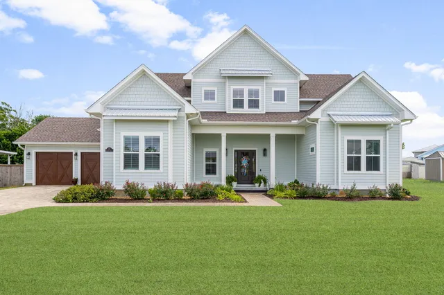 a living room with furniture or chandelier and a flat screen tv