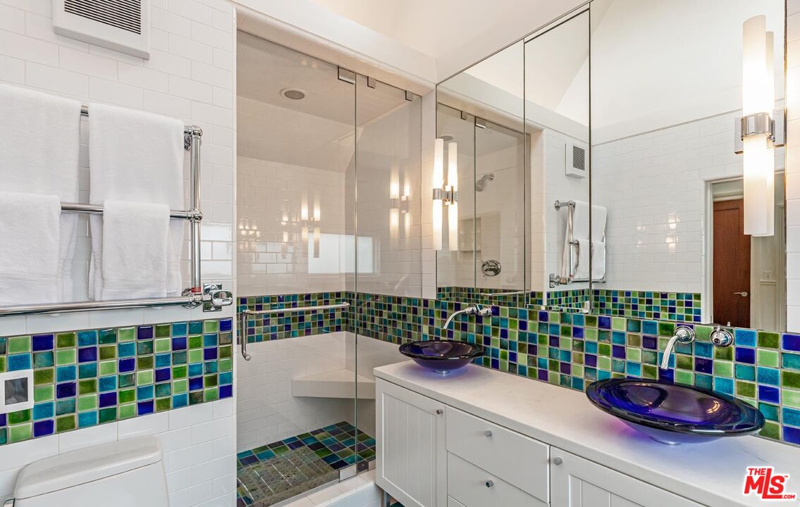 23416 Malibu Colony Road Malibu, CA 90265 - Photo 21 of 26 a bathroom with a sink a mirror and a shower