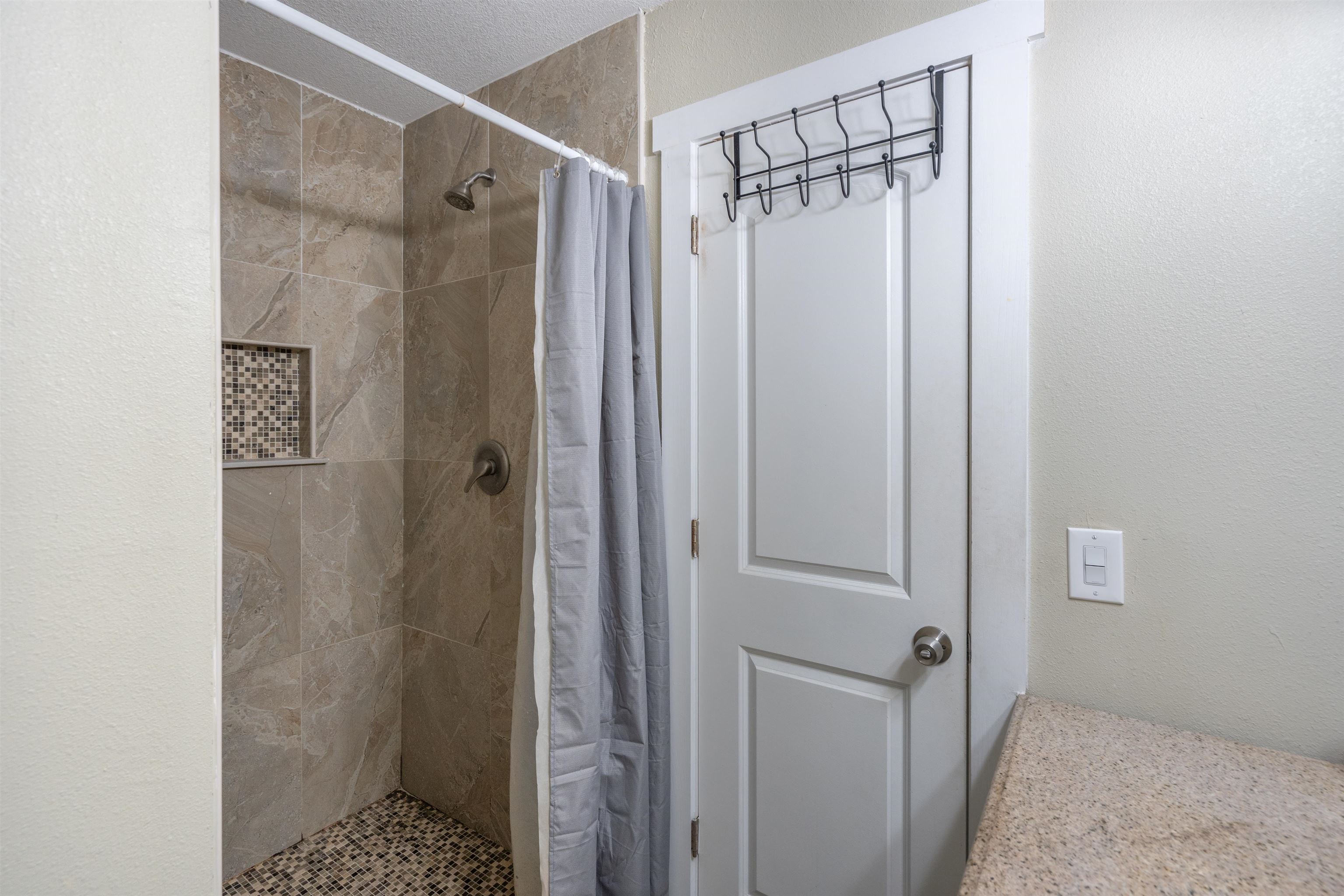 227 North Whitney Street St. Augustine, FL 32084 - Photo 17 of 35 a bathroom with a shower and a sink