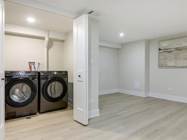 a view of a storage & utility room with washer and dryer