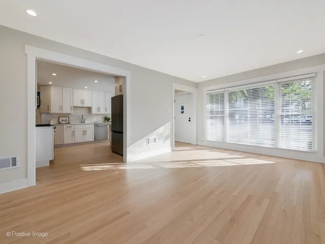 a view of a kitchen with wooden floor and a kitchen