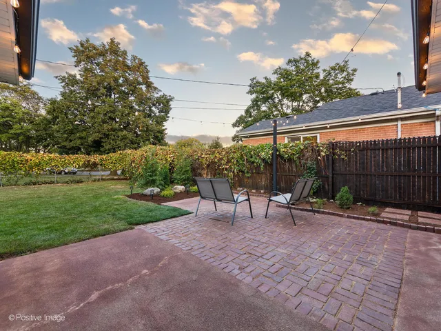 a view of a park with iron fence